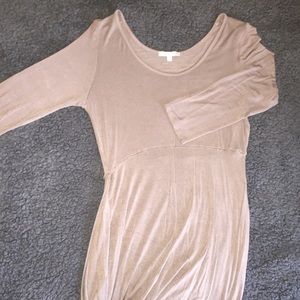 A long sleeve dress with a slit on the right side